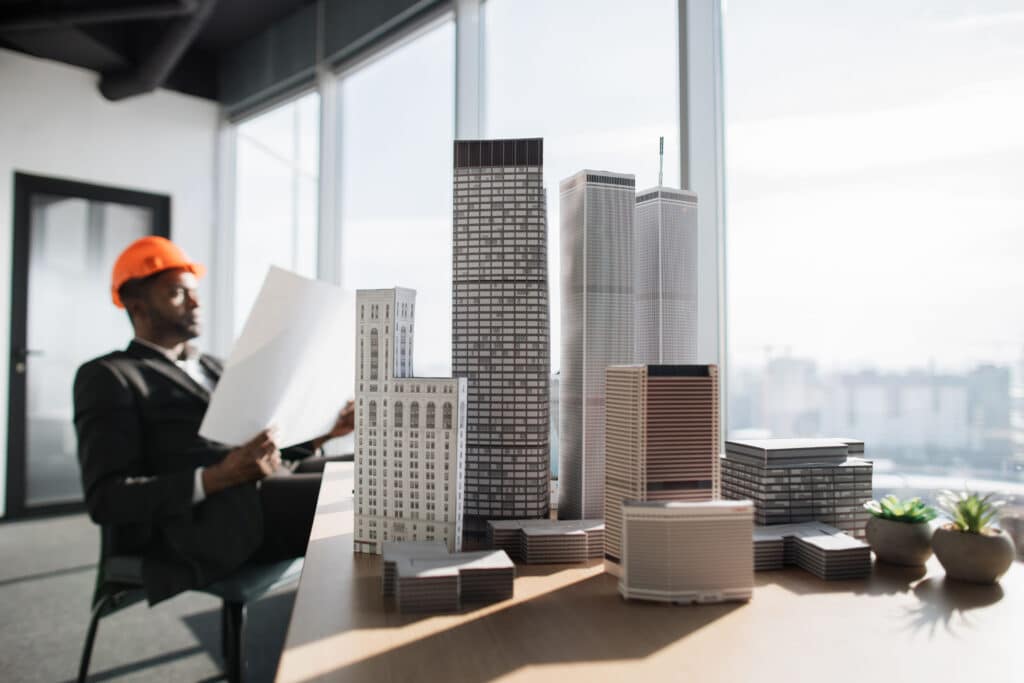 focus-on-city-buildings-model-at-office-interior-w