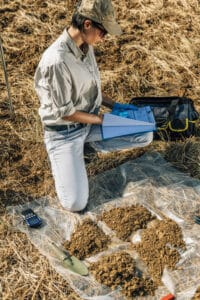 soil-test-female-agronomist-taking-notes-in-the-f